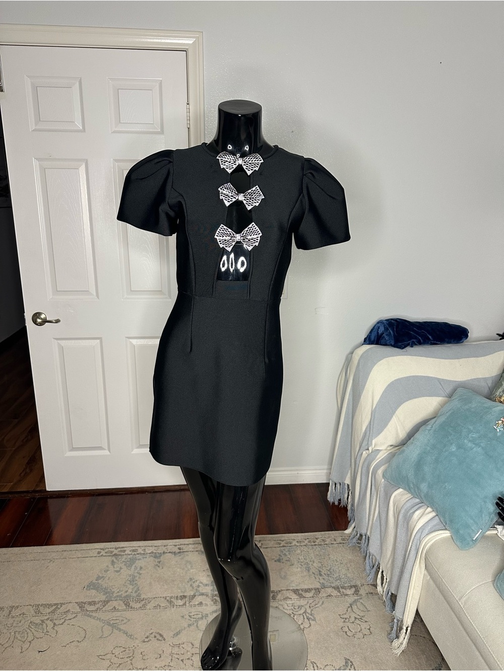 Elegant Black Puff-Sleeve Dress with Decorative Bows